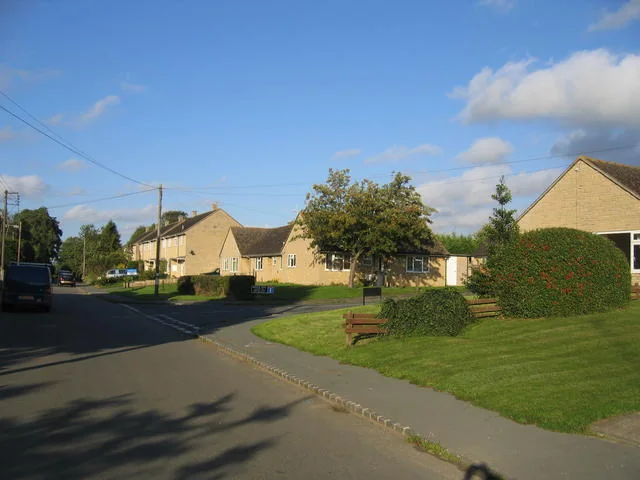 A residential lane and village green in Ascott-under-Wychwood