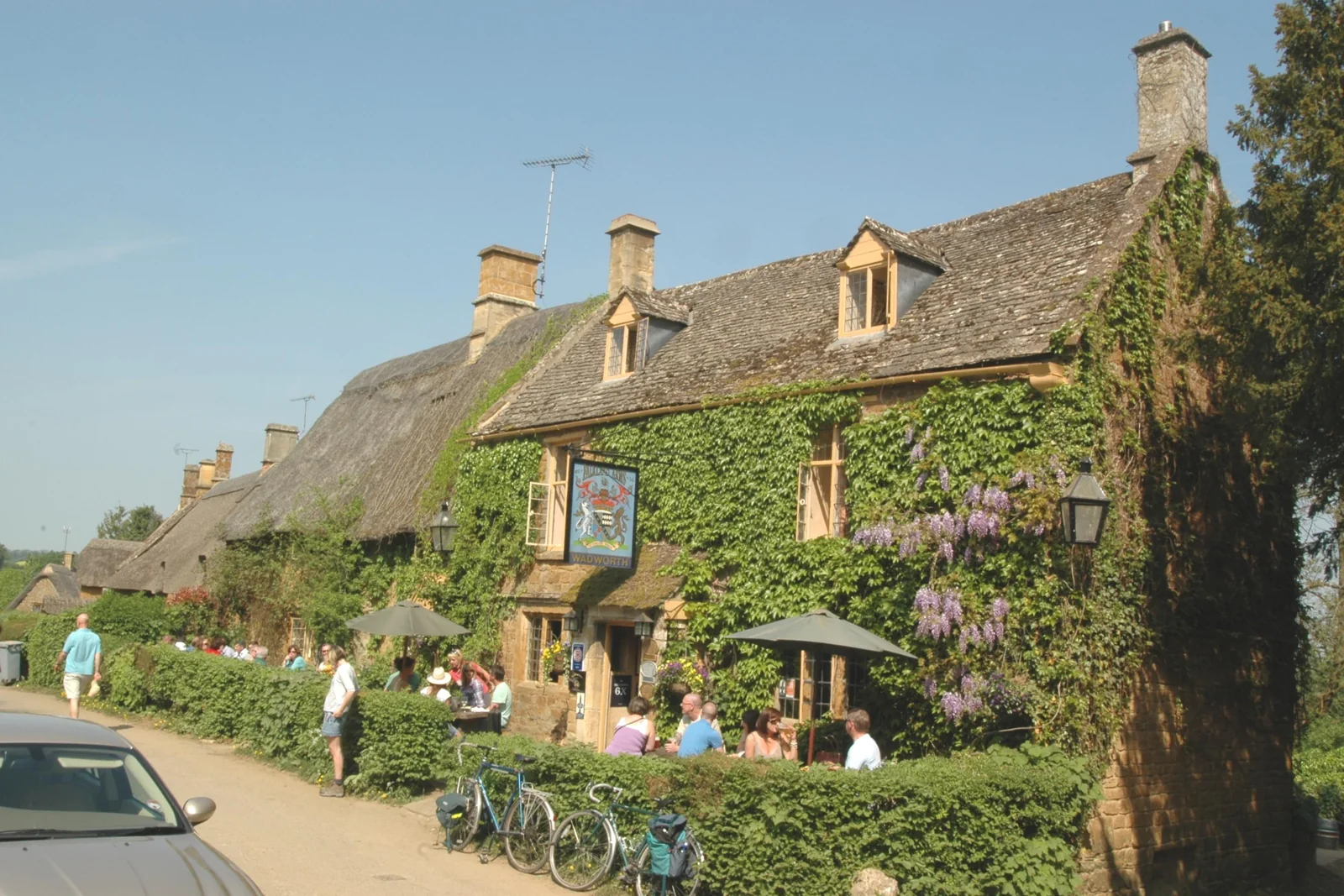 The Falkland Arms among thatched stone cottages in Great Tew