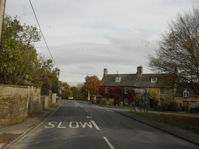 The road through Shipton-under-Wychwood lined with stone buildings