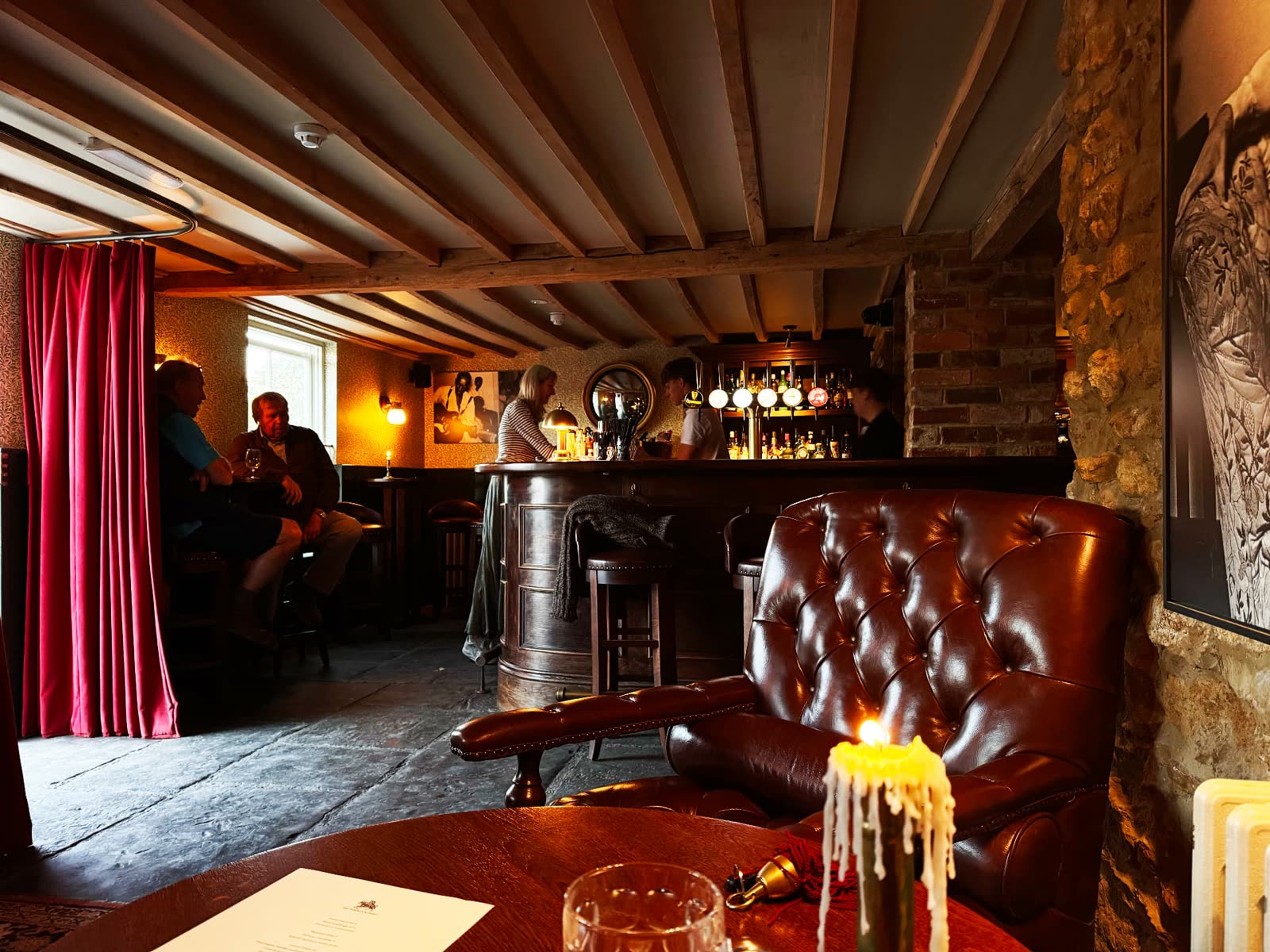 The low-beamed locals' bar at The Norman Knight in Whichford